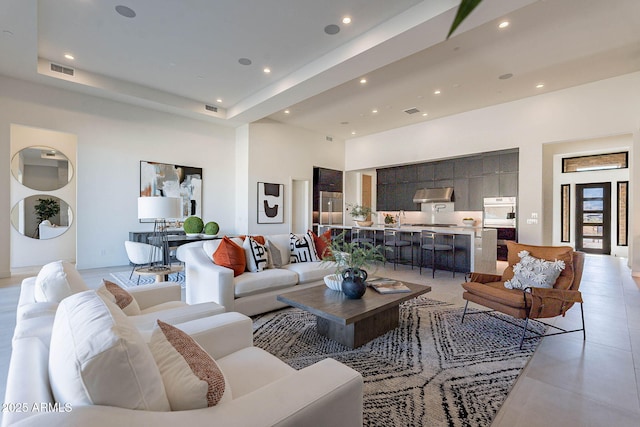 living room with a high ceiling