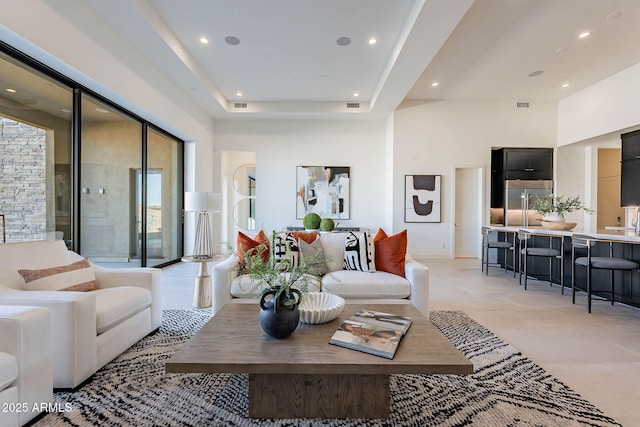 living room with a tray ceiling