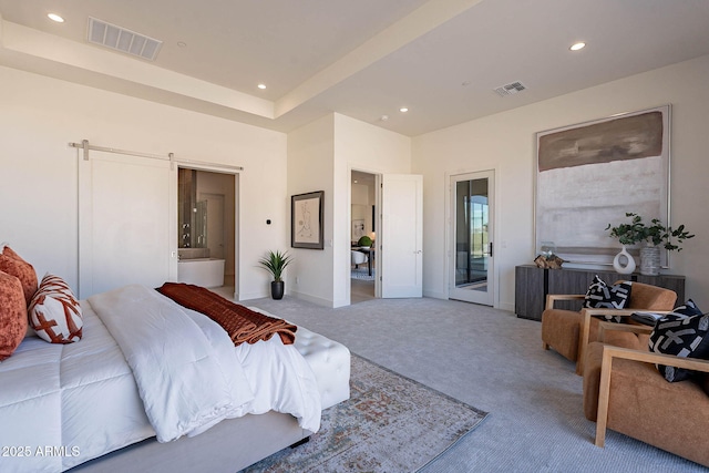 bedroom featuring connected bathroom, a barn door, access to exterior, and carpet flooring