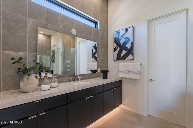 bathroom with walk in shower and vanity