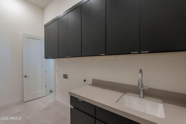 laundry area with sink, cabinets, light tile patterned floors, hookup for a washing machine, and hookup for an electric dryer