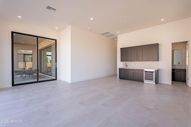 interior space featuring wine cooler and sink