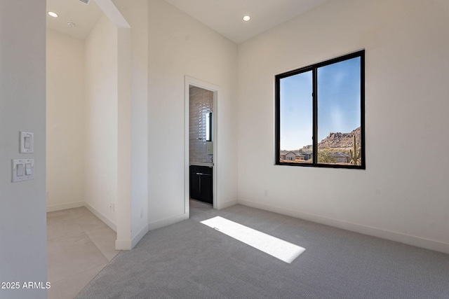 unfurnished bedroom featuring light colored carpet