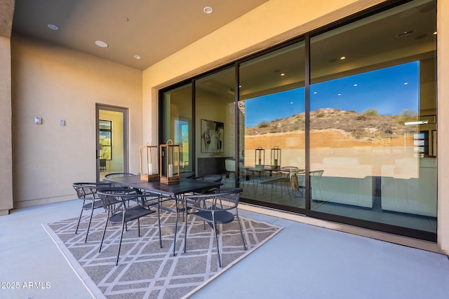 view of patio / terrace featuring a mountain view