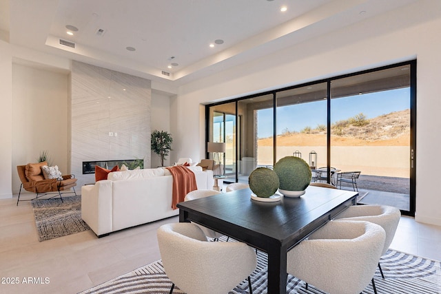 dining area with a tray ceiling