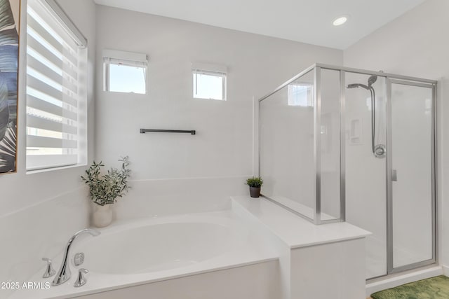 full bathroom featuring a stall shower, a garden tub, and recessed lighting