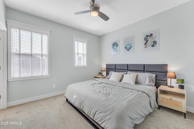 carpeted bedroom featuring a ceiling fan and baseboards