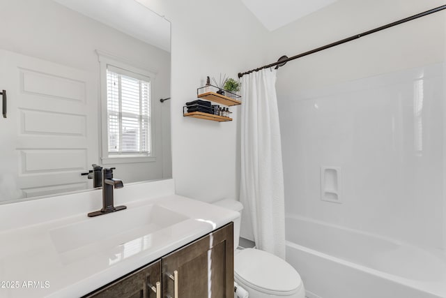 bathroom featuring toilet, shower / tub combo with curtain, and vanity