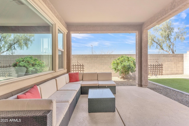 view of patio featuring a fenced backyard, visible vents, and an outdoor living space