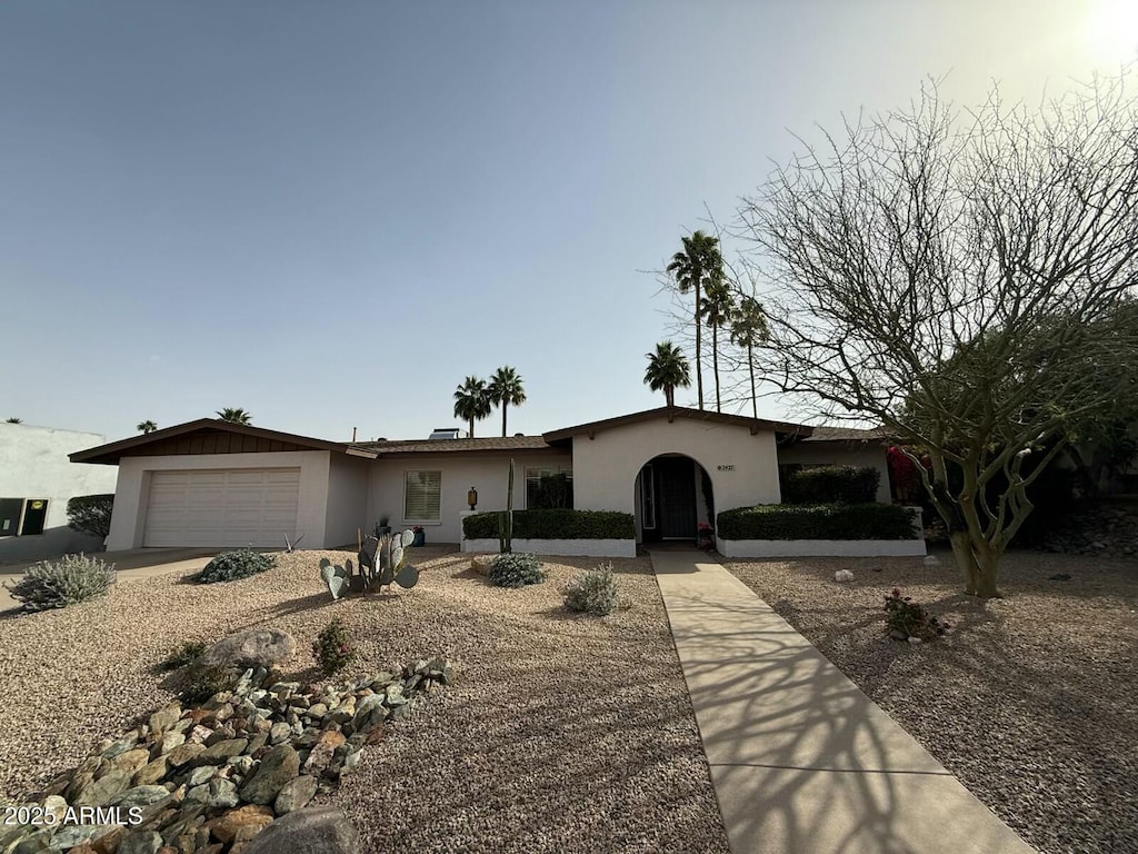 2427 E Cinnabar Ave, Phoenix, AZ 85028 - ranch-style home featuring an attached garage and stucco siding