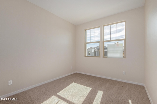 spare room featuring carpet flooring