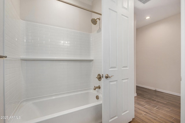 bathroom with washtub / shower combination