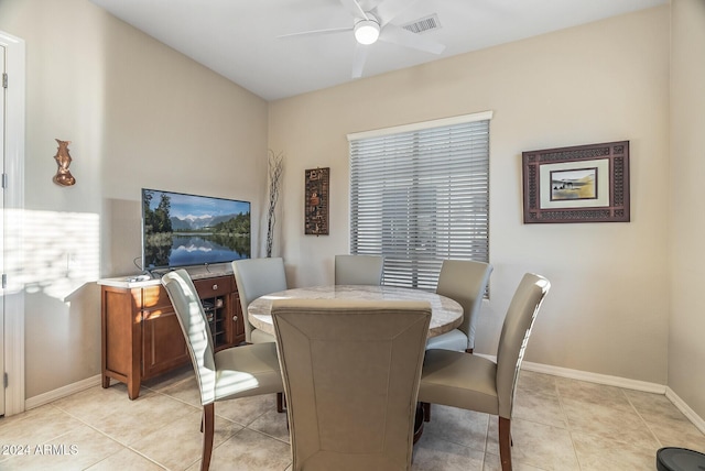 dining room featuring ceiling fan and light tile patterned floors