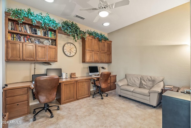 tiled office space with ceiling fan