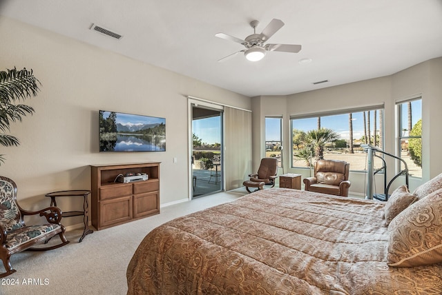 carpeted bedroom featuring access to exterior and ceiling fan