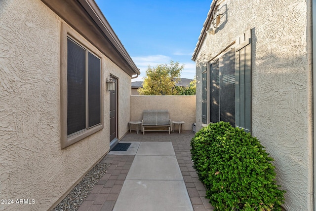 view of side of property featuring a patio