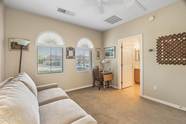 carpeted home office with ceiling fan