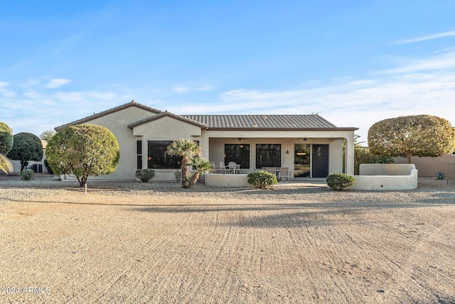 view of front of home featuring ceiling fan