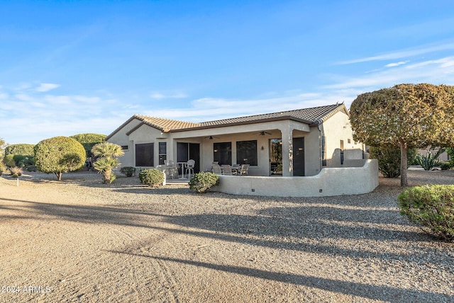 view of front of house featuring ceiling fan