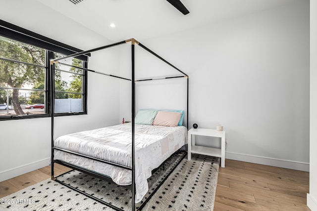 7851 N Central Ave, Phoenix, AZ 85020 - bedroom with baseboards, light wood-type flooring, ceiling fan, and recessed lighting