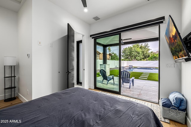 7851 N Central Ave, Phoenix, AZ 85020 - bedroom featuring access to exterior, wood finished floors, baseboards, and recessed lighting