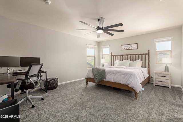 7858 W Fetlock Trl, Peoria, AZ 85383 - bedroom with an office area, carpet flooring, and a ceiling fan