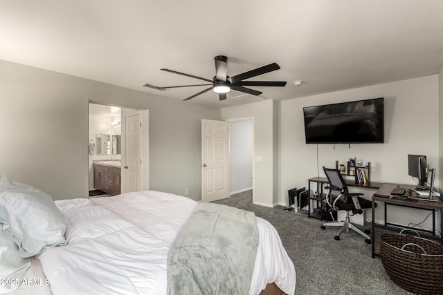 7858 W Fetlock Trl, Peoria, AZ 85383 - carpeted bedroom with an office area, ceiling fan, and connected bathroom