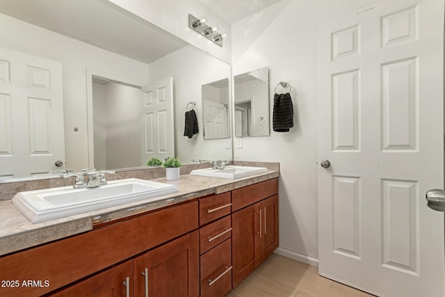 7858 W Fetlock Trl, Peoria, AZ 85383 - bathroom featuring double vanity and wood finished floors