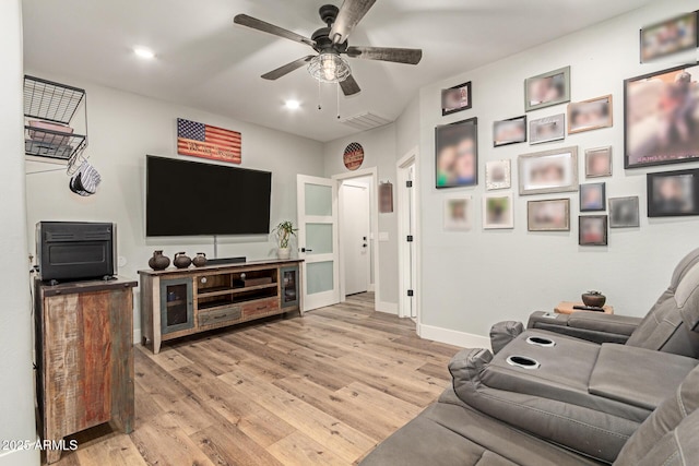 7858 W Fetlock Trl, Peoria, AZ 85383 - living room with light wood-type flooring, ceiling fan, and recessed lighting