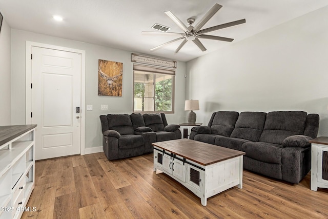 7858 W Fetlock Trl, Peoria, AZ 85383 - living area featuring wood finished floors and a ceiling fan