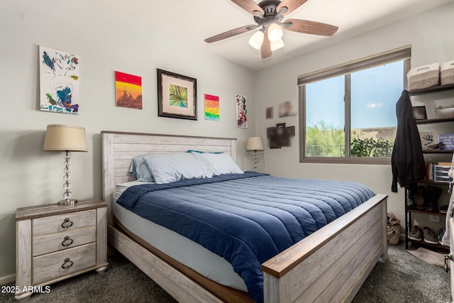 7858 W Fetlock Trl, Peoria, AZ 85383 - bedroom with dark carpet and ceiling fan