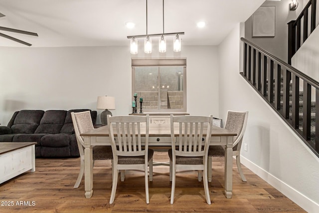 7858 W Fetlock Trl, Peoria, AZ 85383 - dining room with wood finished floors, a ceiling fan, stairway, and recessed lighting