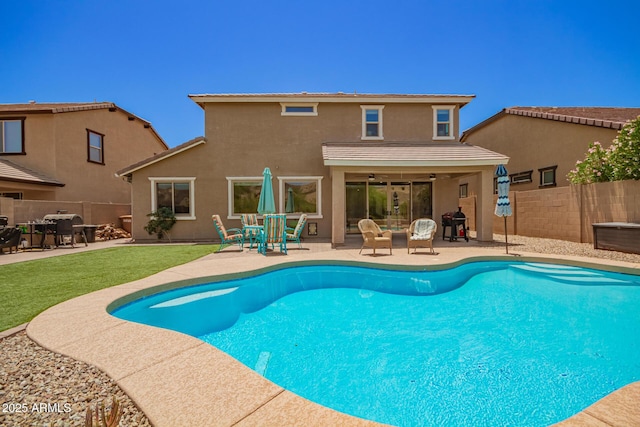 7858 W Fetlock Trl, Peoria, AZ 85383 - view of swimming pool with a patio area, a fenced backyard, a ceiling fan, and a grill