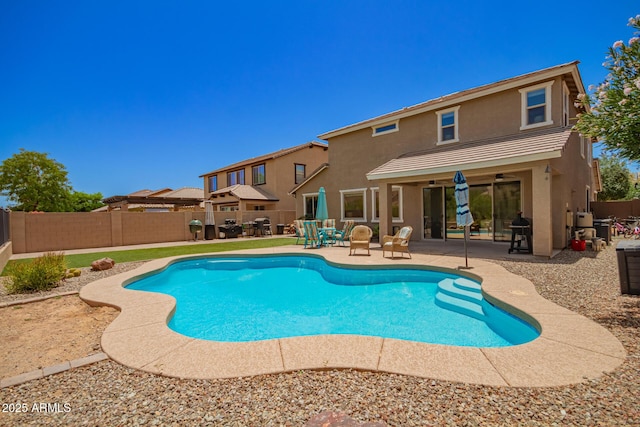 7858 W Fetlock Trl, Peoria, AZ 85383 - view of swimming pool with a patio area, a fenced backyard, and a ceiling fan