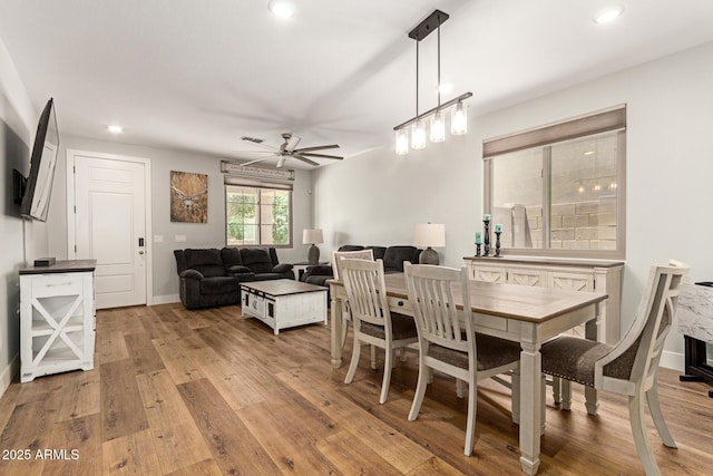 7858 W Fetlock Trl, Peoria, AZ 85383 - dining room with light wood-type flooring, a ceiling fan, and recessed lighting
