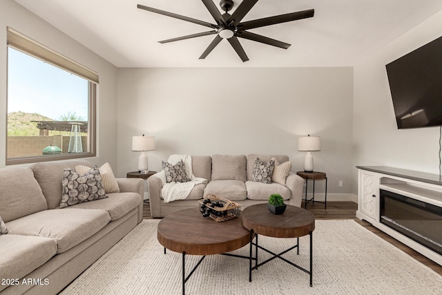 7858 W Fetlock Trl, Peoria, AZ 85383 - living room with wood finished floors and a ceiling fan