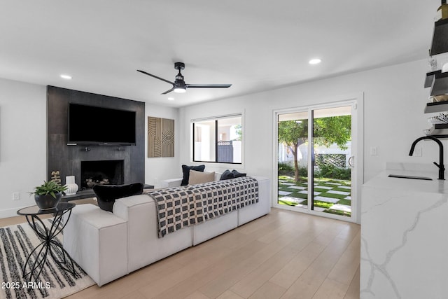 10360 N 98th St, Scottsdale, AZ 85258 - living area featuring a ceiling fan, recessed lighting, wood finished floors, and a premium fireplace