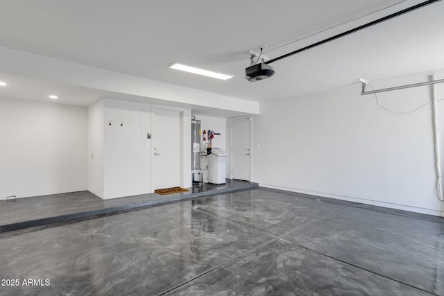 10360 N 98th St, Scottsdale, AZ 85258 - garage featuring recessed lighting, a garage door opener, and electric water heater