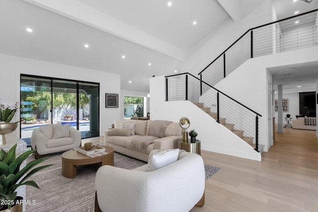 10360 N 98th St, Scottsdale, AZ 85258 - living room with stairs, beam ceiling, high vaulted ceiling, recessed lighting, and light wood-style flooring