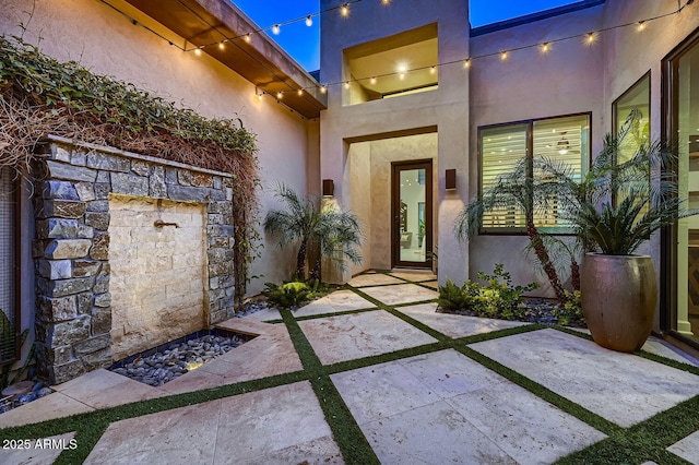 property entrance with a patio area