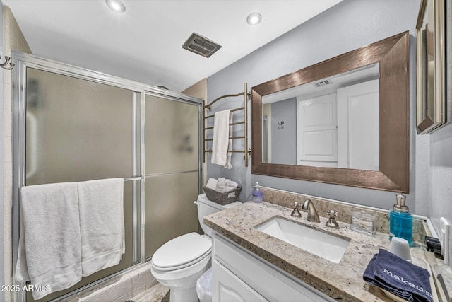 7625 E Camelback Rd Unit B138, Scottsdale, AZ 85251 - bathroom featuring vanity, toilet, and a stall shower