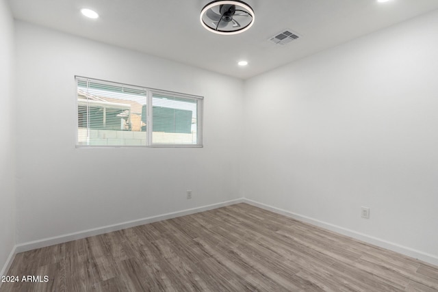 spare room featuring light hardwood / wood-style floors