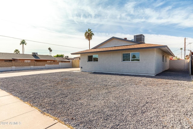 view of property exterior with central AC unit