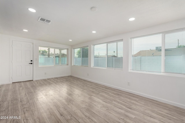 unfurnished sunroom featuring vaulted ceiling