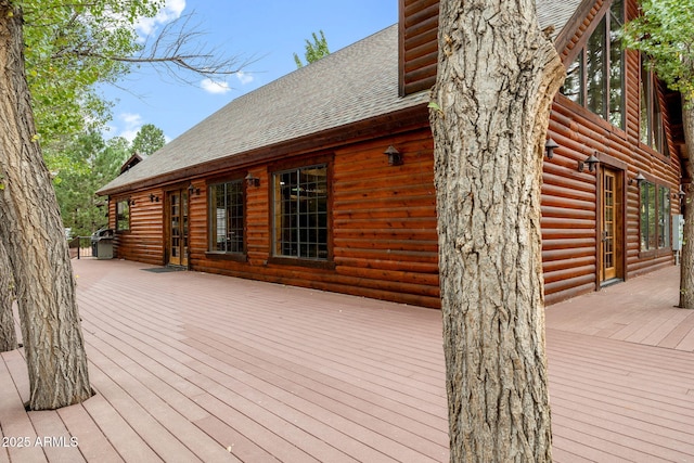 deck with french doors and grilling area