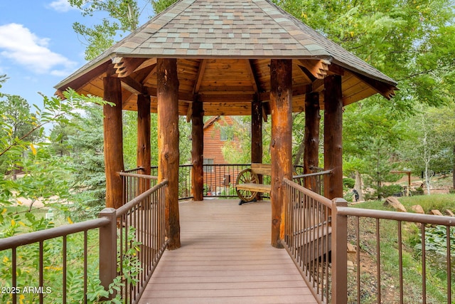 wooden terrace featuring a gazebo