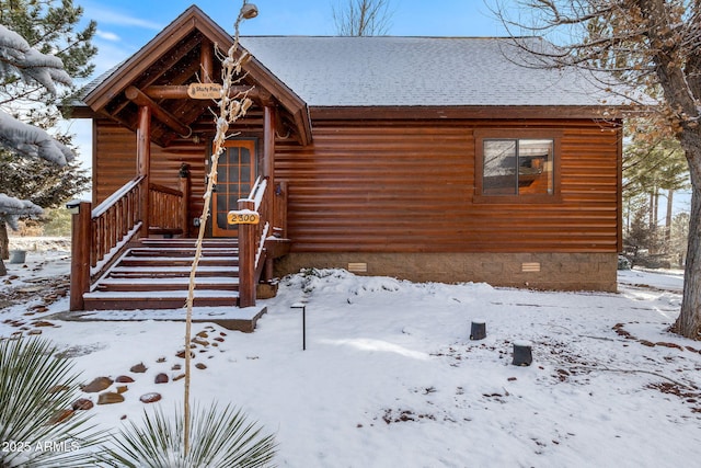 view of front of property featuring crawl space and a shingled roof