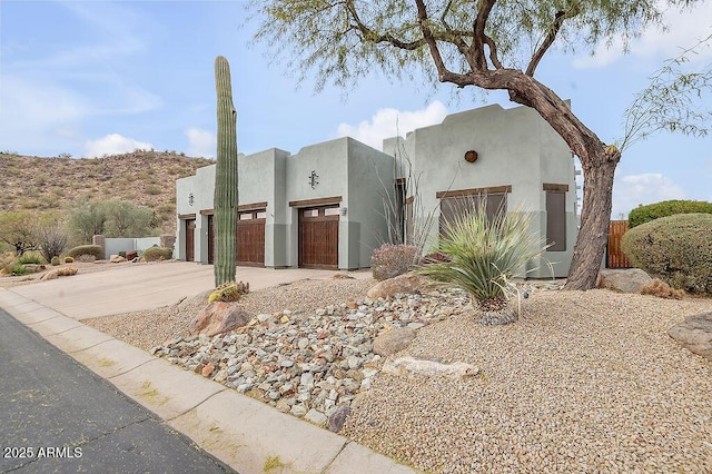 southwest-style home featuring a garage