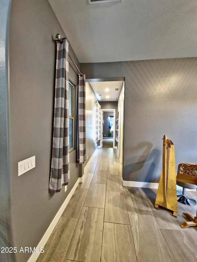 9187 W Parkside Ln, Peoria, AZ 85383 - hallway featuring baseboards and wood finished floors