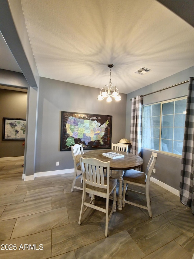 9187 W Parkside Ln, Peoria, AZ 85383 - dining space with a chandelier and baseboards